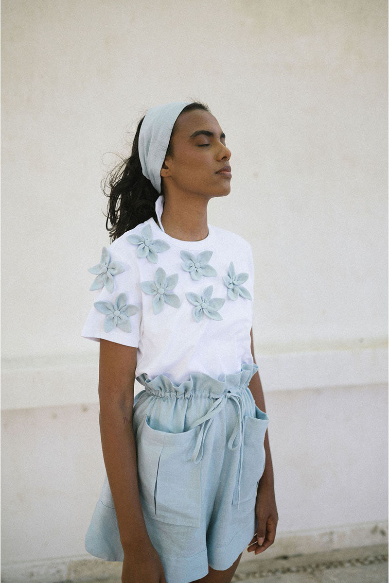 Light blue ANA + MARIA Elia T-shirt, casual top with a relaxed fit, displayed on a plain background.