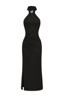 Nana Jacqueline Eliana black maxi dress displayed on a hanger, featuring flowing fabric and elegant design.
