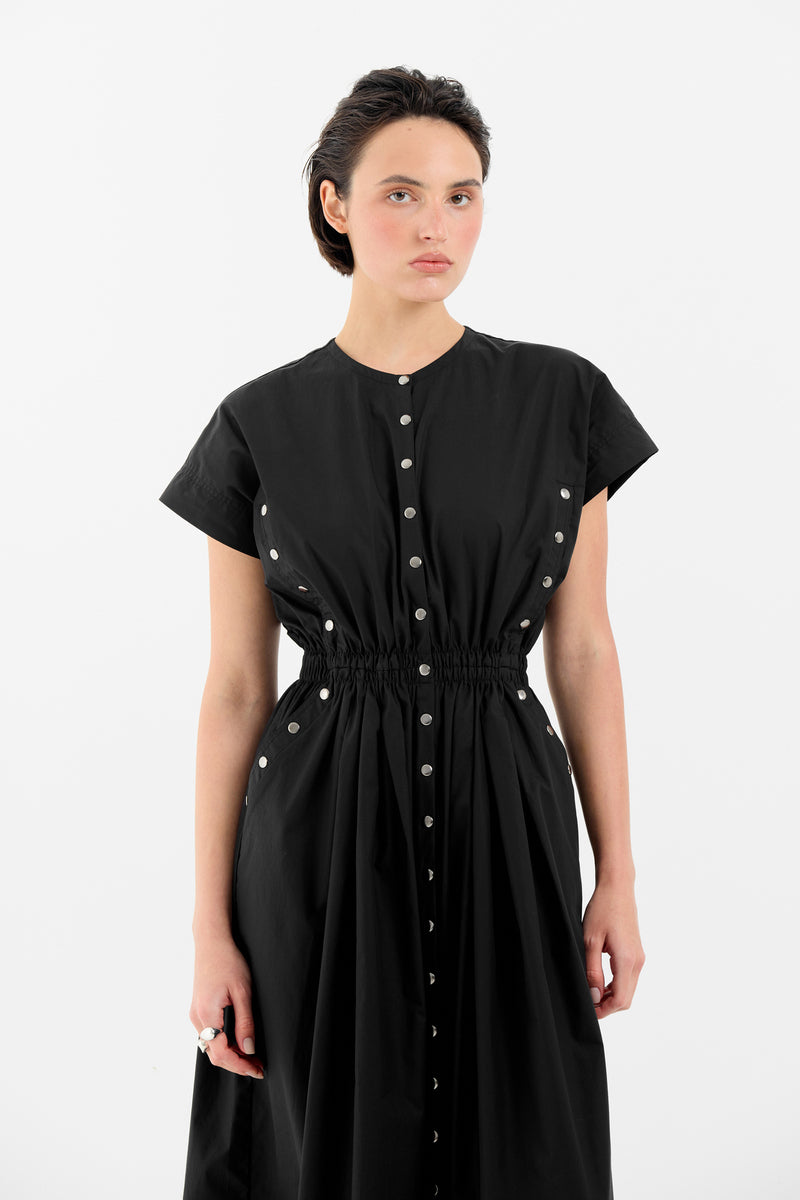 Black ELIZ maxi dress by Tamar Keburia, featuring flowing fabric and elegant design, shown in a full-length image.