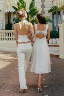 Nana Jacqueline Ella flared pants in champagne color, stylish and comfortable with a relaxed fit, shown on a model.