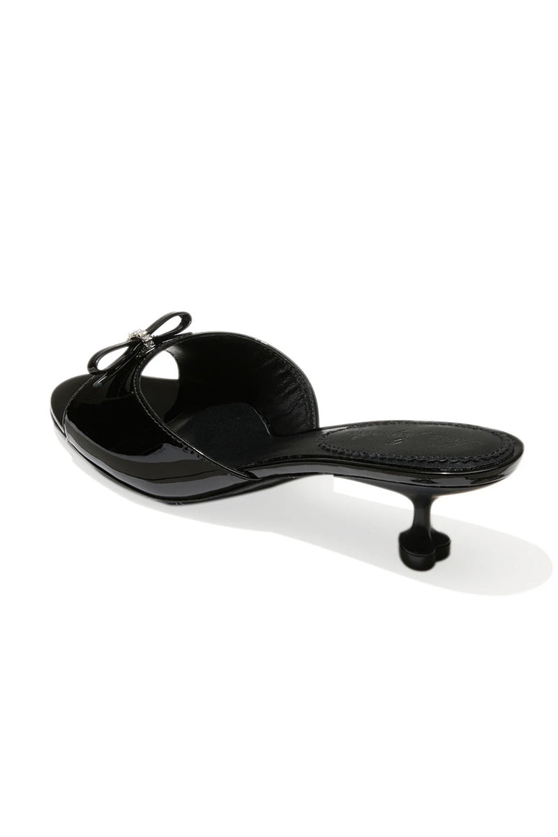 Black Nana Jacqueline Ella Heart heels shown from the back, featuring stylish heart-shaped details and sleek design.