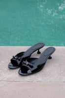 Black Ella Heart heels by Nana Jacqueline featuring a stylish heart-shaped design and elegant ankle strap.