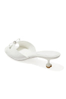 White Nana Jacqueline Ella Heart Heels shown from the back, featuring elegant design and stylish heel detail.