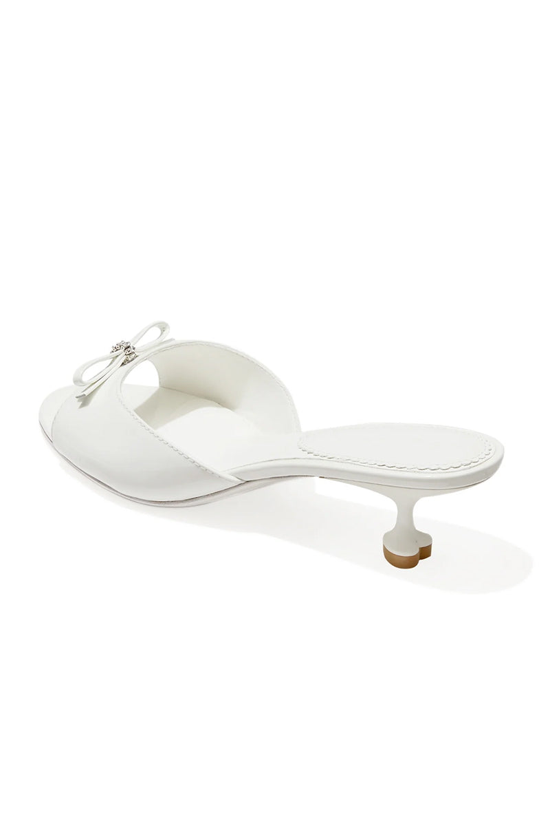 White Nana Jacqueline Ella Heart Heels shown from the back, featuring elegant design and stylish heel detail.