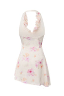 Nana Jacqueline Ella floral mini dress with ruffle halter neckline in beige, shown from the back.