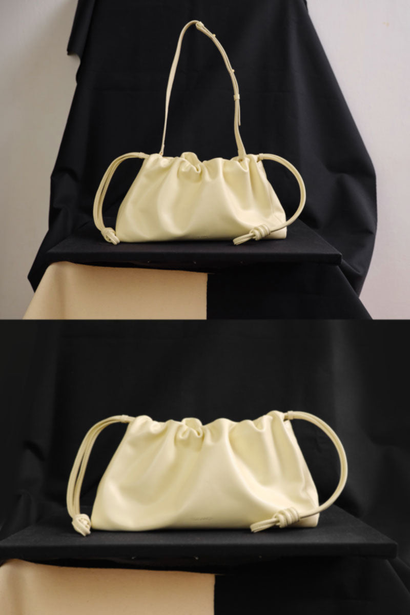 TUEAM'S Elora shoulder bag in butter yellow with a sleek design and adjustable strap, perfect for casual or chic outfits.