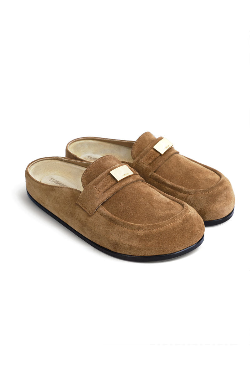 Light brown suede TUEAM'S clogs featuring a flat sole and classic slip-on design, showcasing soft, textured material.