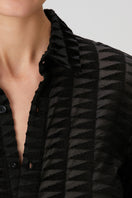 Black embossed tulle shirt by Bassigue, showcasing textured tulle fabric and stylish design, perfect for fashionable outfits.