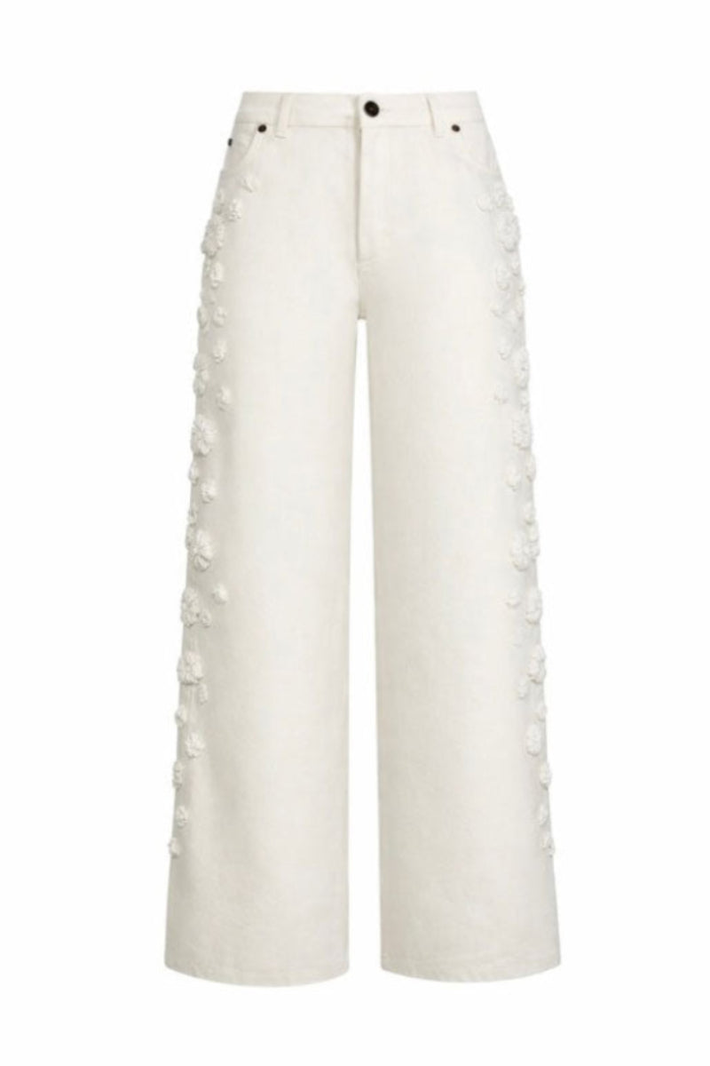 White embroidered jeans by Santa Brands featuring detailed floral embroidery and classic denim fit.