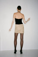 Nué BERTA corset top displayed on a hanger, showcasing its fitted design and structured bust with lace-up detail.