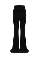 Black Estelle velvet pants by Nana Jacqueline, showing the smooth fabric and stylish, tailored fit.