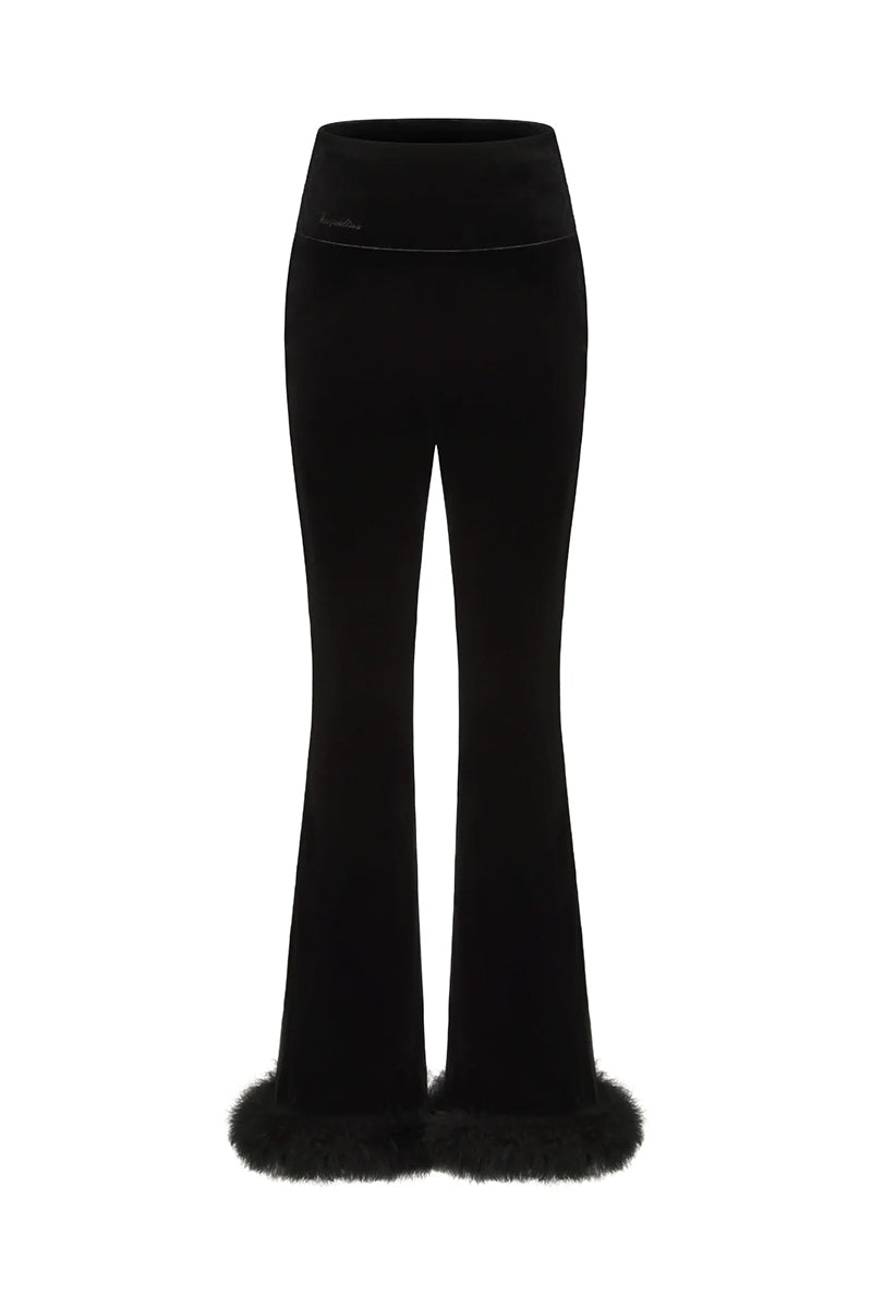 Black Estelle velvet pants by Nana Jacqueline, showing the smooth fabric and stylish, tailored fit.