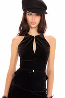 Nana Jacqueline black velvet top, stylish women’s sleeveless blouse with a elegant draped neckline, shown in a lookbook image.
