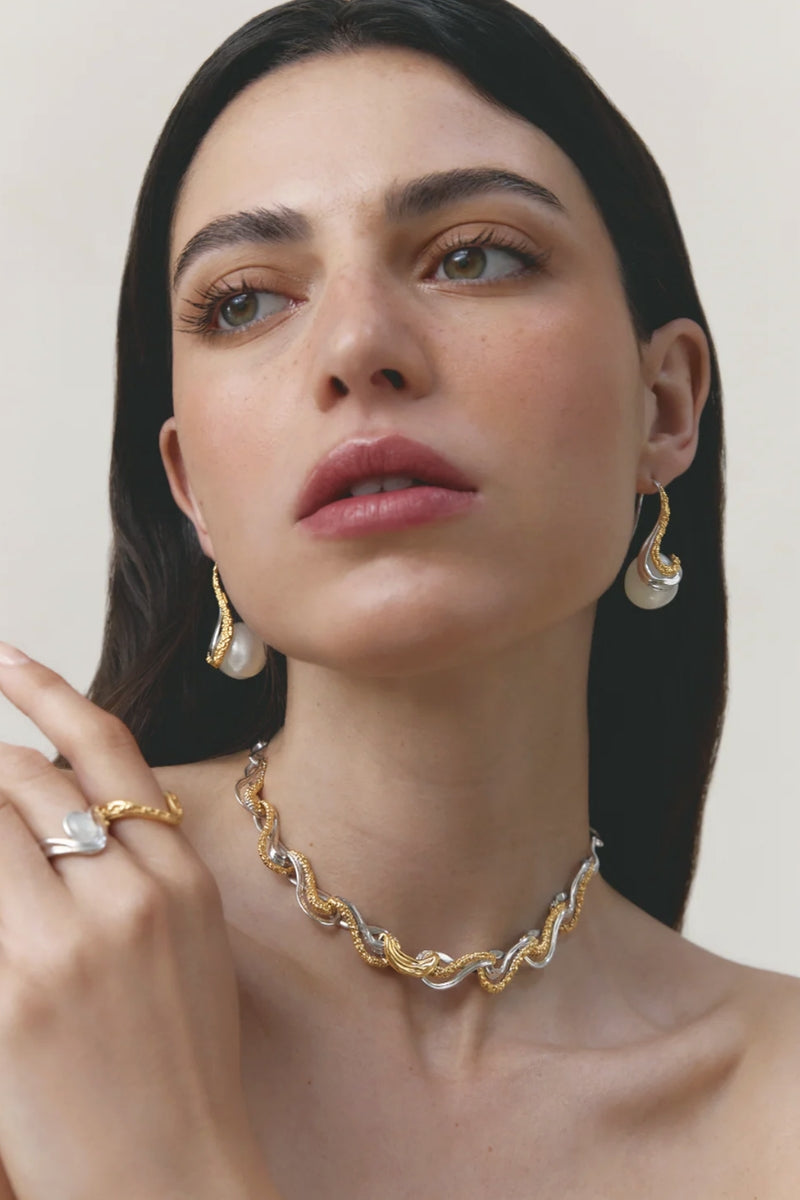 Jude Benhalim Eternity Earrings showcasing elegant, circular gold earrings with intricate design details.