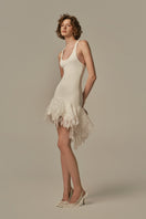 White POEM ÉTHER MINI DRESS on a model, showcasing a stylish short dress with a sleek fit and minimalist design.