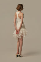 White POEM ÉTHER MINI DRESS on a model, showcasing a stylish short dress with a fitted silhouette and modern design.