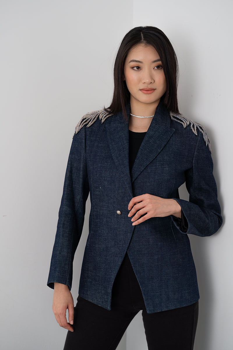 Nadya Shah AVA denim blazer for women, featuring classic blue denim fabric and tailored fit, styled with buttons and lapel collar.
