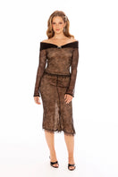 Black Evelina midi skirt by Nana Jacqueline, shown with flowing fabric and stylish design on model.