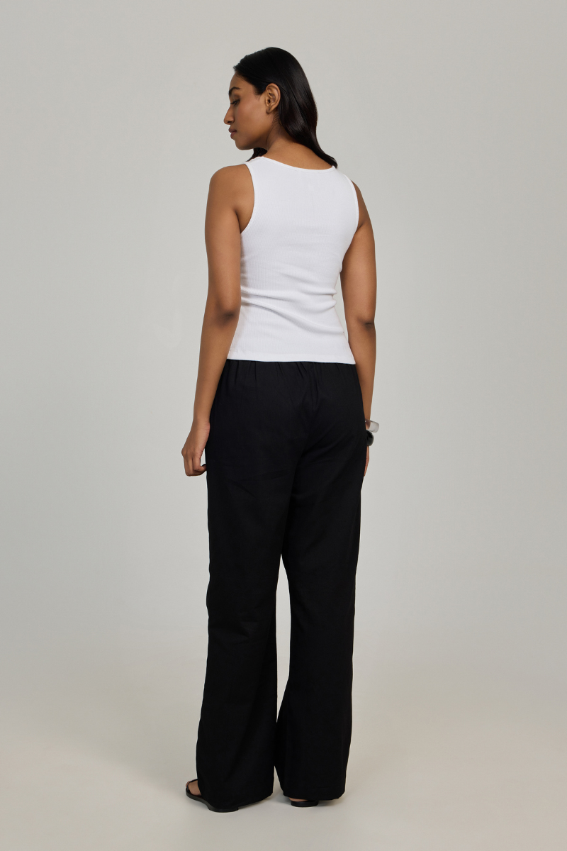 White Evia top by Summer Away, stylish sleeveless women's blouse with a relaxed fit and V-neck design.