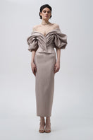 Beige volumetric corset top by Monetre, featuring structured design and intricate details, styled on a model.