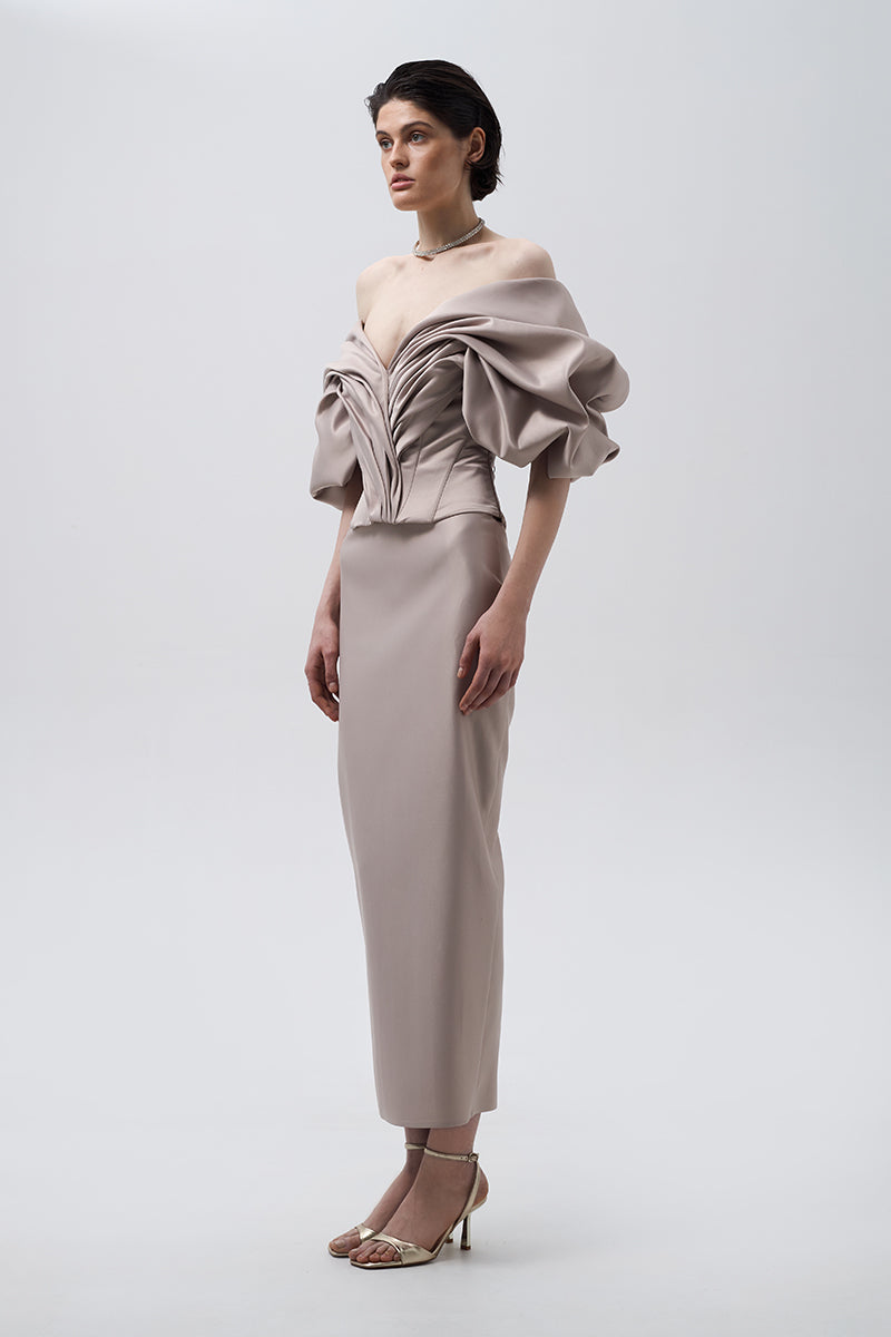 Beige volumetric corset top by Monetre featuring structured design and fitted silhouette, displayed on a neutral background.