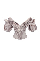 Beige volumetric corset top by Monetre, featuring structured design and intricate detailing, styled on a model.