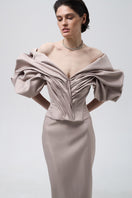 Beige volumetric corset top by Monetre, featuring structured design and detailed stitching, displayed on a neutral background.