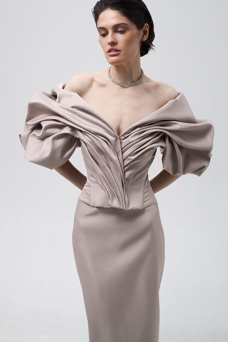 Beige volumetric corset top by Monetre, featuring structured design and detailed stitching, displayed on a neutral background.