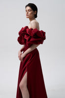 Elegant Bordo Meringue dress by Monetre, showcasing a flowing gown with intricate detailing and luxurious fabric.