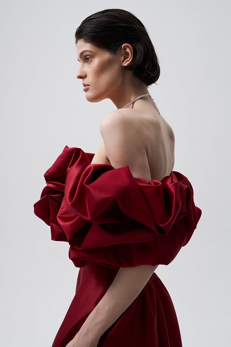 Monetre Meringue Dress in Bordo, elegant gown with flowing fabric and intricate details, perfect for formal occasions.
