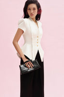 Jenny K Tran Faringdon blazer jacket in a stylish tailored design, shown in a versatile color on a mannequin.