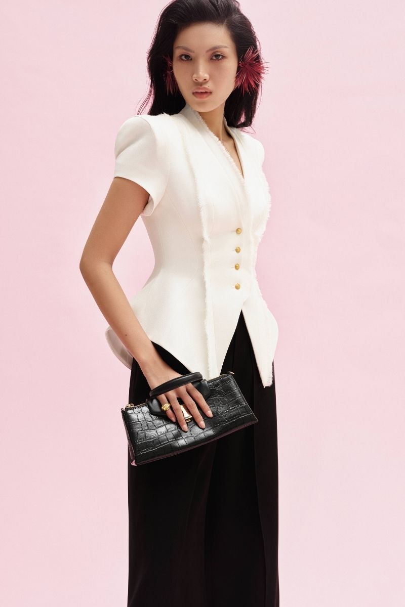 Jenny K Tran Faringdon blazer jacket in a stylish tailored design, shown in a versatile color on a mannequin.