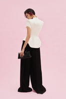 Jenny K Tran Faringdon blazer jacket in tailored black with notch lapels, displayed on a mannequin.