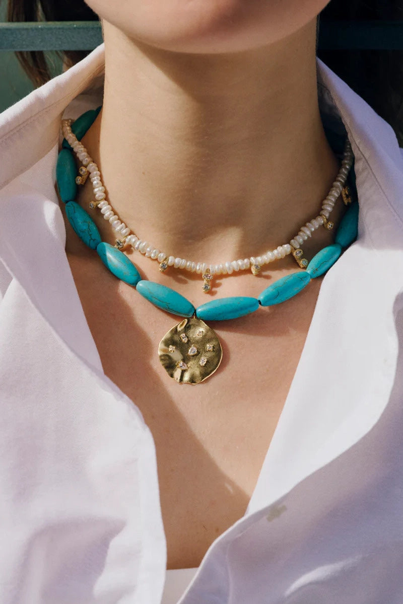 Turquoise MARE Necklace by PERACAS featuring vibrant turquoise beads and intricate design, perfect for elegant accessories.