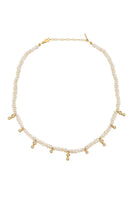 Fiesole Pearl Necklace in ivory by Peracas, featuring elegant pearl strands and a classic design for sophisticated style.