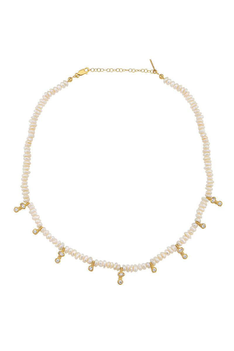 Fiesole Pearl Necklace in ivory by Peracas, featuring elegant pearl strands and a classic design for sophisticated style.