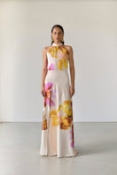 Floral Tinta Latina Fiore maxi dress with vibrant floral pattern, flowing fabric, and sleeveless design perfect for summer wear.