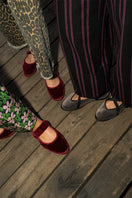 Flabelus Mafalda burgundy flats with brown piping, showcasing stylish slip-on footwear with a sleek design and comfortable fit.