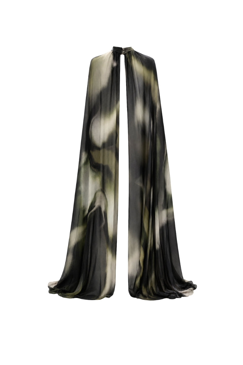 Green print FLO overlay cover-up by TINTA LATINA with flowing fabric and vibrant tropical design.