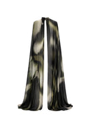 Green print FLO overlay cover-up by TINTA LATINA with flowing fabric and vibrant tropical design.