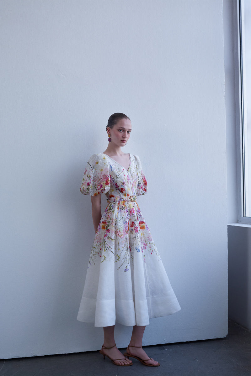 AISA floral midi dress with a flowing silhouette and delicate fabric, perfect for elegant daytime wear.