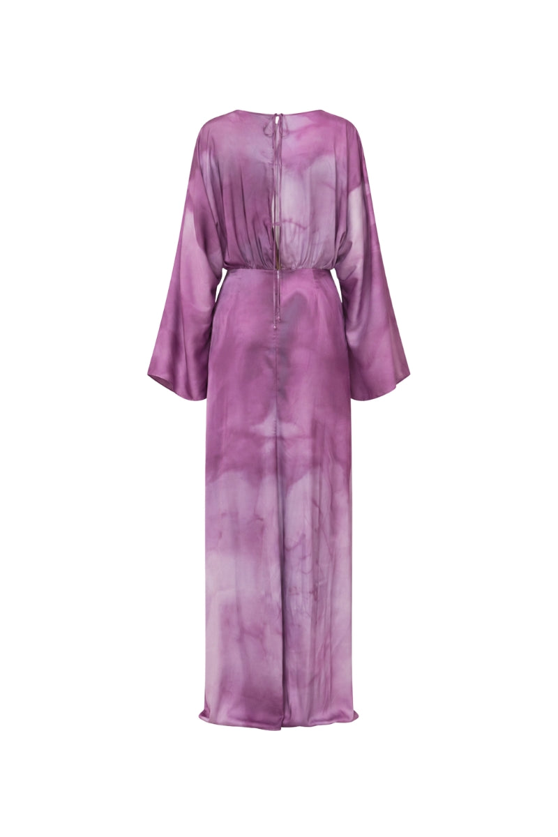 Purple printed maxi dress from Tinta Latina's Floresta collection, flowing fabric with floral design, ideal for summer wear.