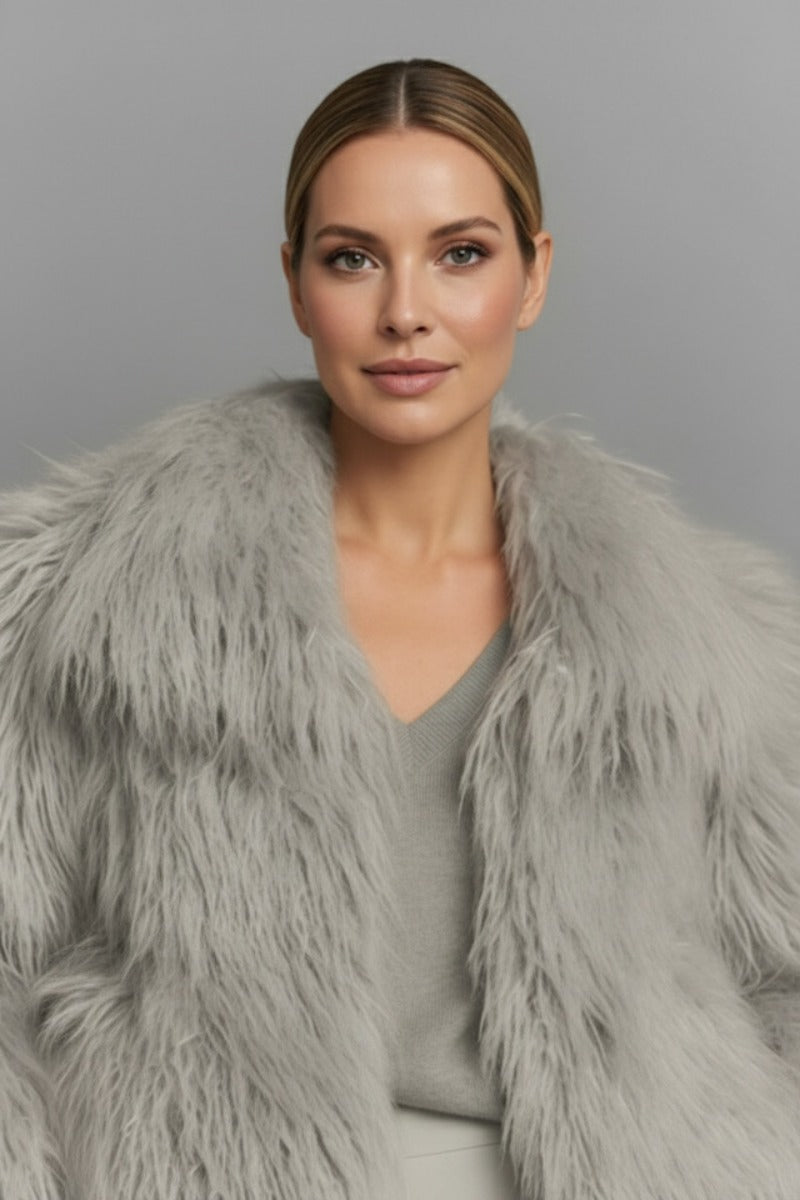 Gray fluffy faux fur jacket by Fortini, featuring a cozy, plush texture and stylish design perfect for cold weather.