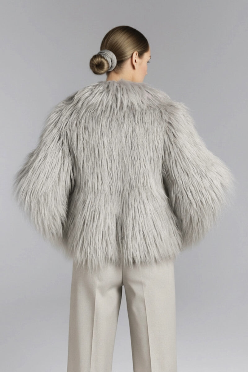 Gray fluffy faux fur jacket by Fortini, shown on a model, featuring a cozy, plush texture and stylish winter design.