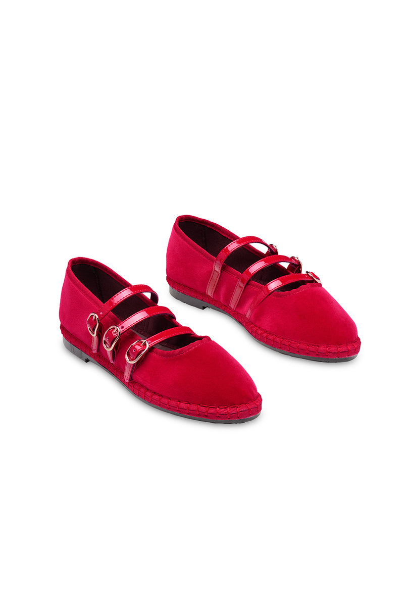 Red Flabelus Mina flats with pointed toes and sleek design, shown on a white background.