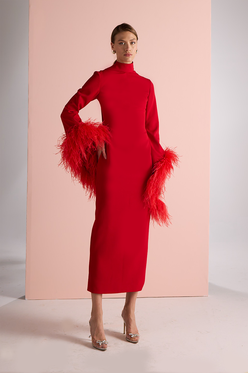 Red halter neck midi dress by Joanna Andraos, front view showing fitted bodice and flowing skirt.