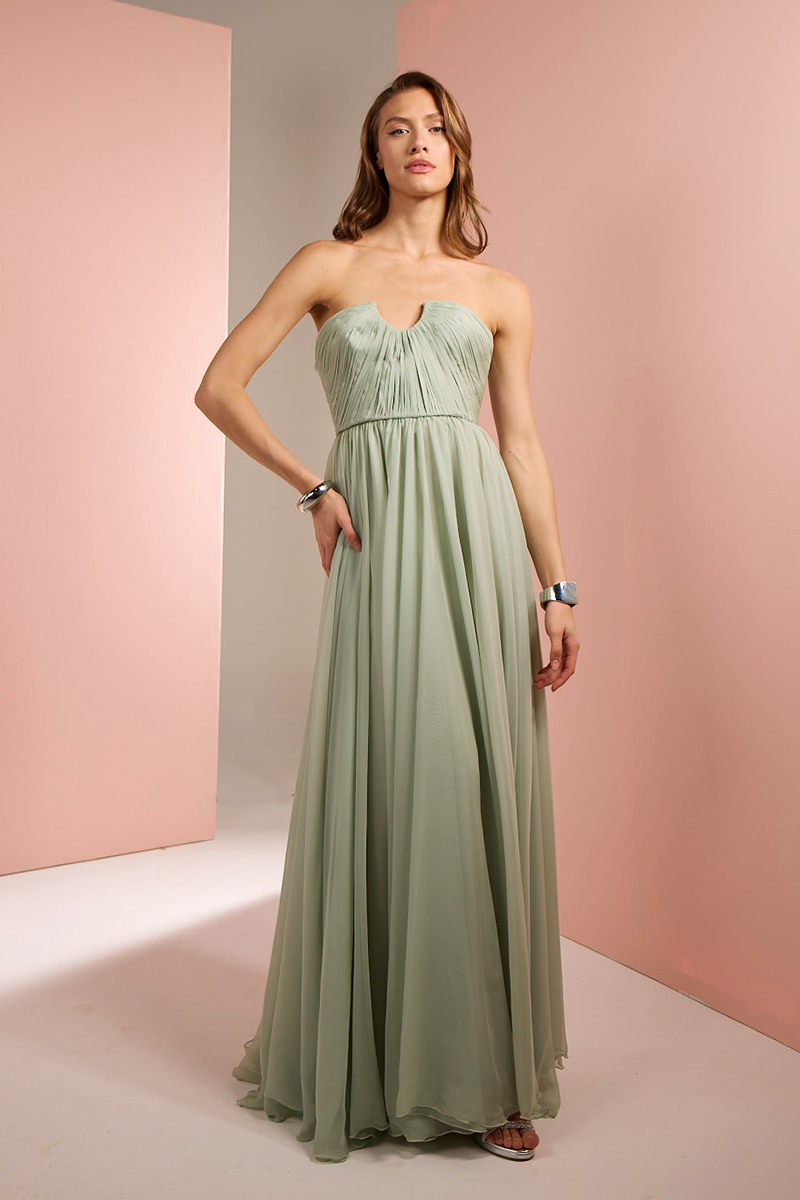 Light green strapless gown by Joanna Andraos, front view showcasing elegant bodice and flowing fabric.