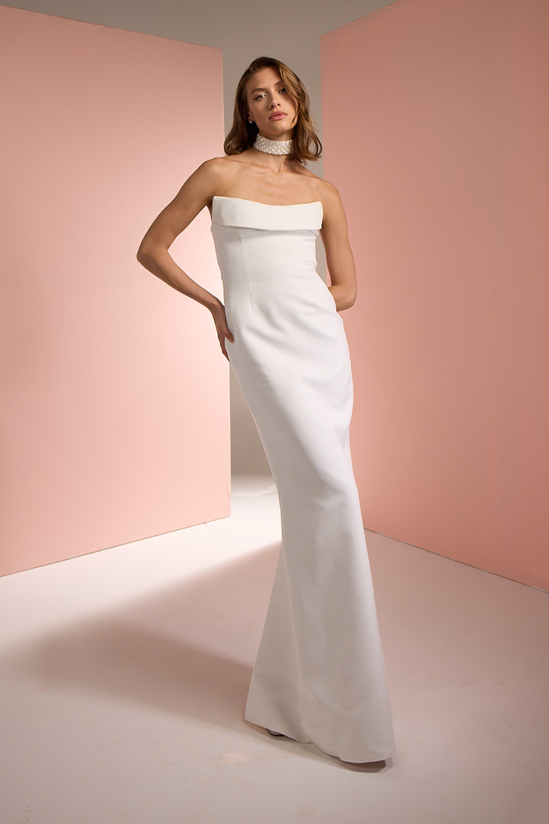 Joanna Andraos white strapless gown featuring a fitted bodice and flowing skirt, elegant formal dress for special occasions.