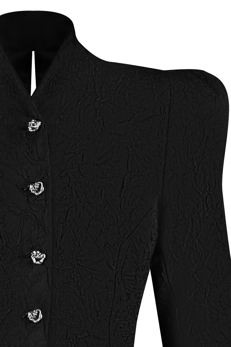 Sean Sheila BESKAP jacket from the Tops collection, featuring detailed stitching and stylish design in a close-up view.