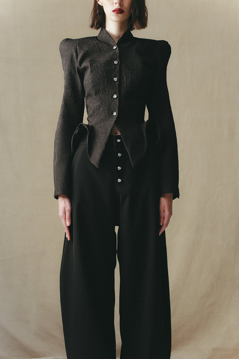 Close-up of Sean Sheila BESKAP Jacket showing detailed fabric texture and stitching, part of the FW25 collection.